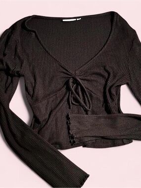 black long-sleeve top with tie / bow detail